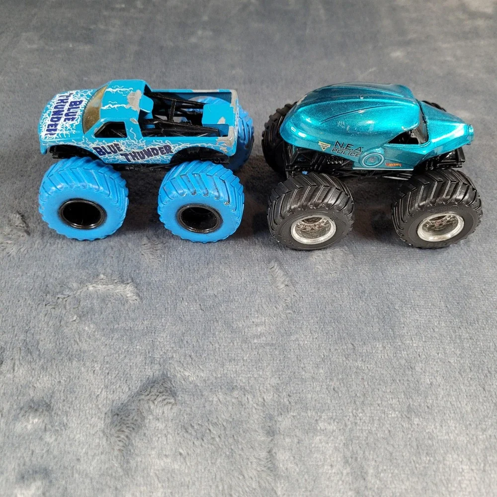 Hot Wheels Monster Jam Blue Thunder and NEA Police 1:64 Diecast Truck Lot of 2